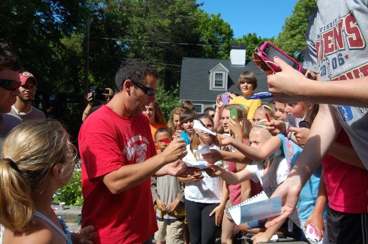 Lead Actor Adam Sandler signs autographs for a large crowd of his fans on the North Shore during filming of GrownUps2.